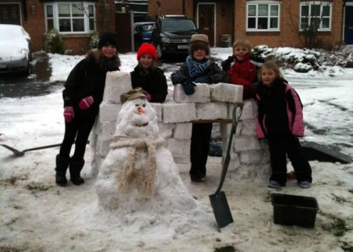 Marie Gibson sent us these two pictures, during and after construction! She says kids from New Broughton came together to build snowmen and a fort!