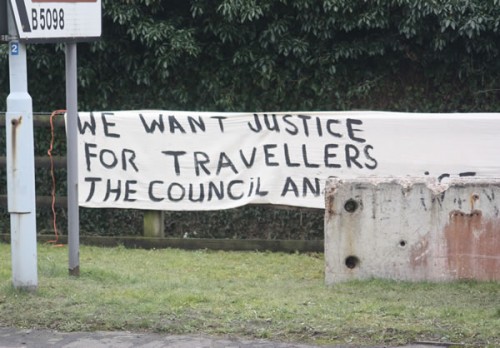 One of the protest signs accuse the Council and Police of 'Prejudice'.