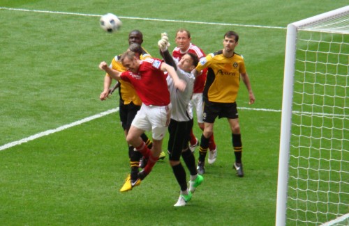 Ormerod challenges for the ball.