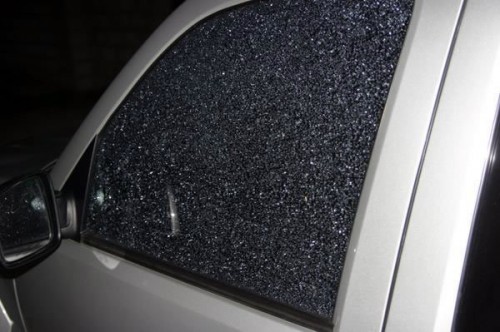 The car window that was destroyed in the shooting.