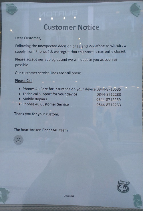 The sign posted in the window of Wrexham Phones4u this morning