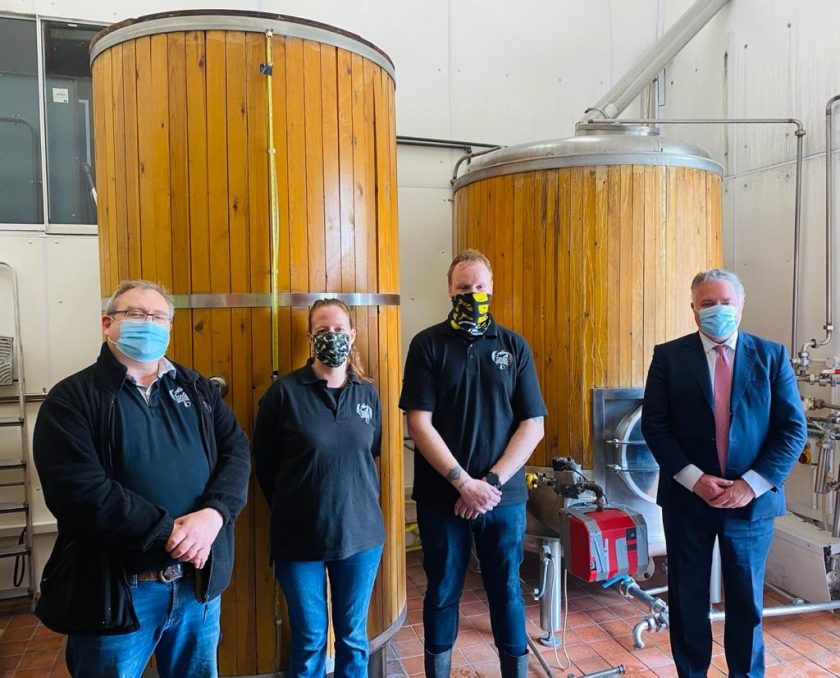 Richard Lever (Founder), Liz Lever (Office Manager), Nick Bradshaw (Brewery Assistant) with Simon Baynes MP inside the Magic Dragon Brewery