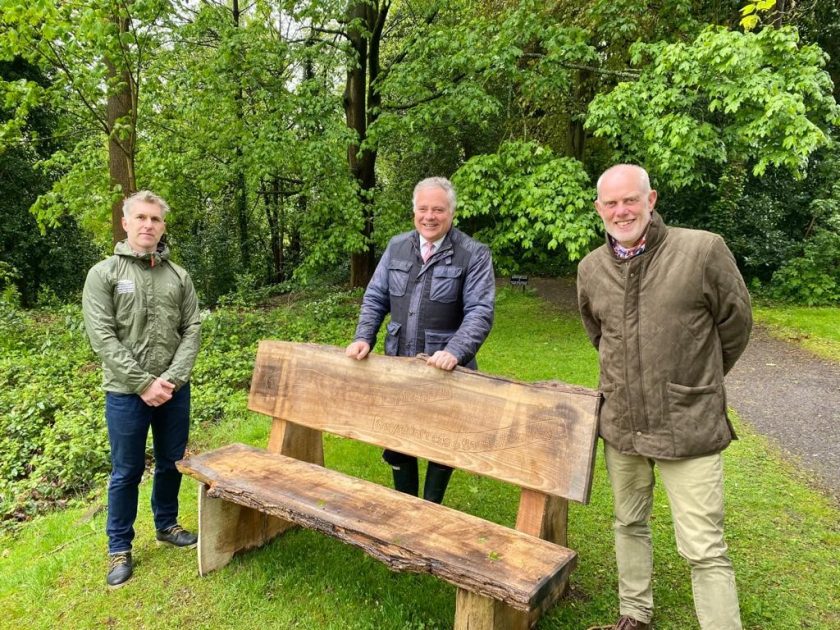 Paul Evans (Manager of Plas Newydd), Simon Baynes MP and Howard Sutcliffe (AONB Officer, Clwydian Range and Dee Valley) with one of the elm seats 