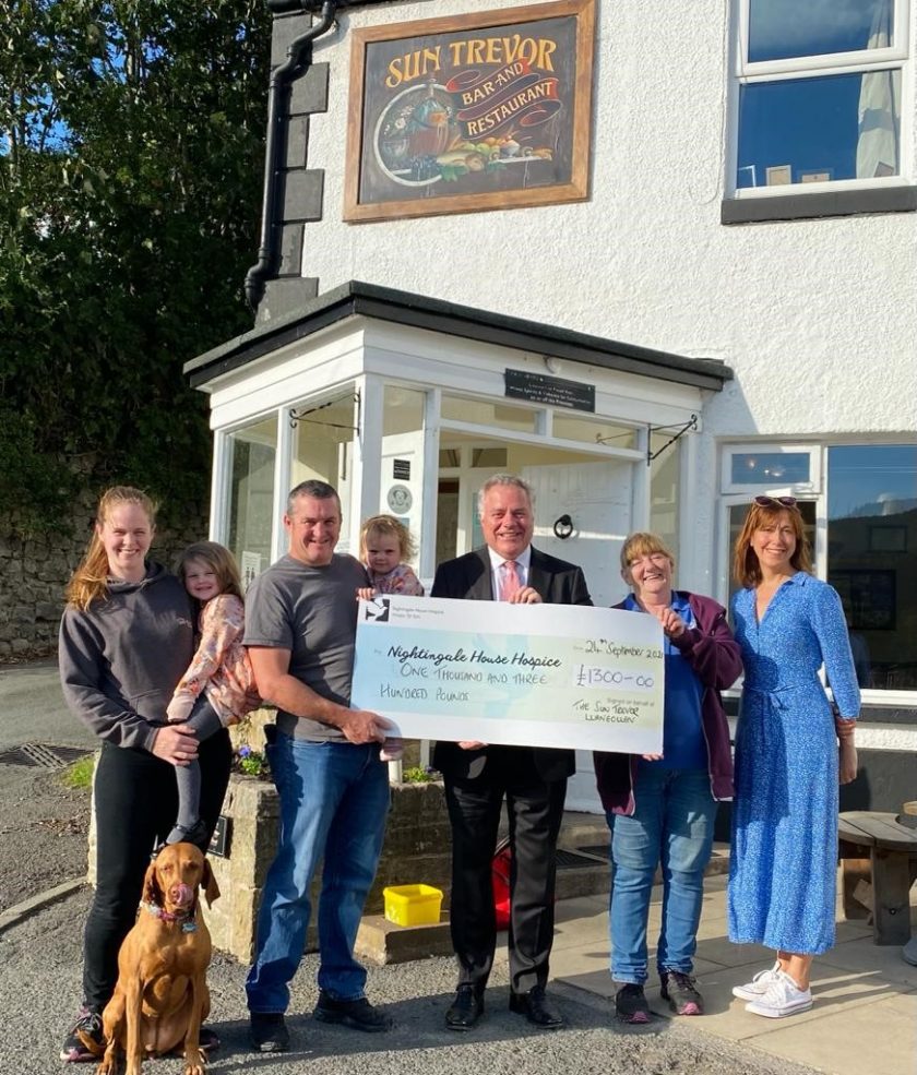 Simon Baynes MP with Sun Trevor owners, Paul and Katy Jones; their daughters, Seren and Darcey; dog, Poppy; Maggie Smith; and Sue Williams at the Sun Trevor.